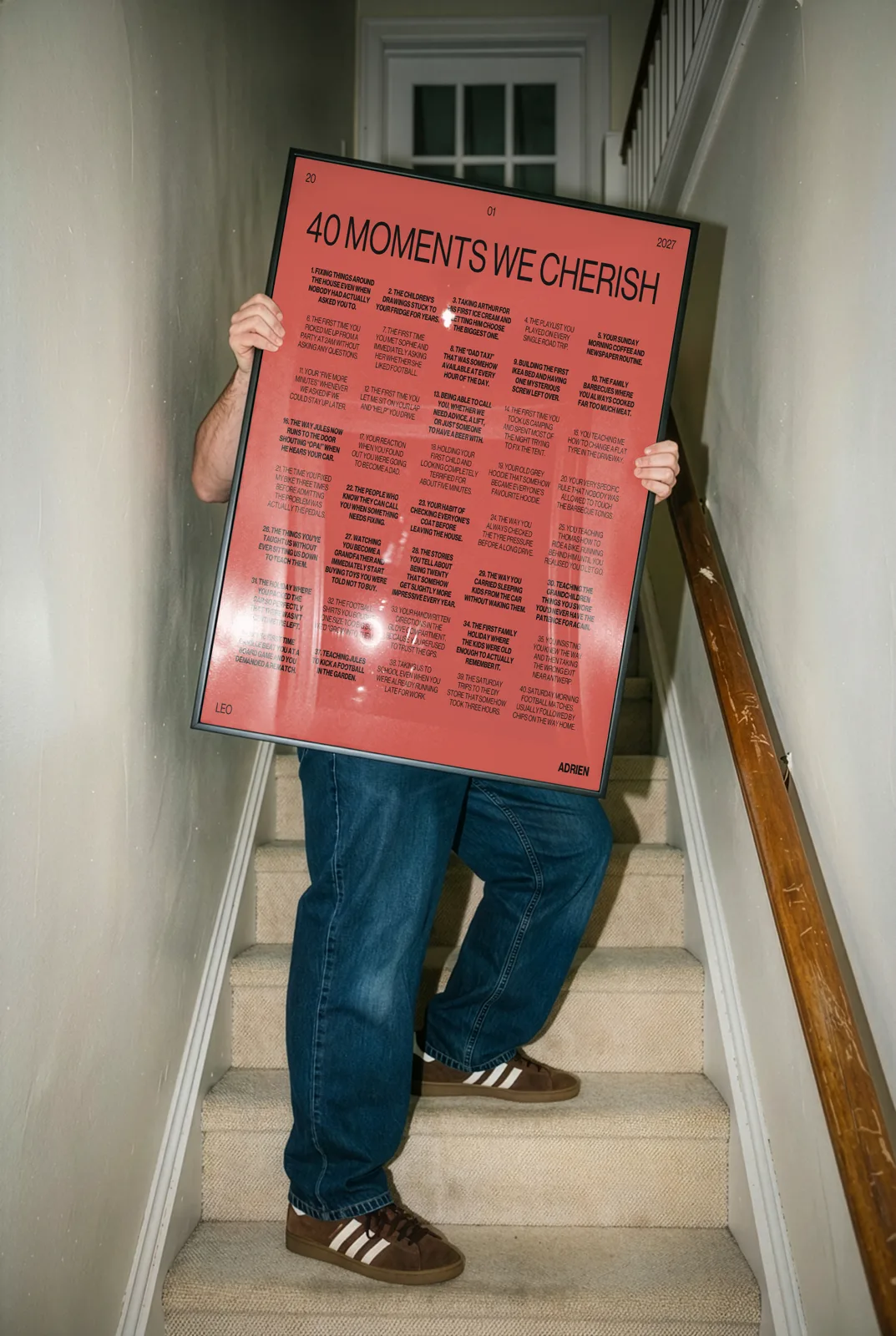 40 moments Tilted poster in red, carried up a staircase