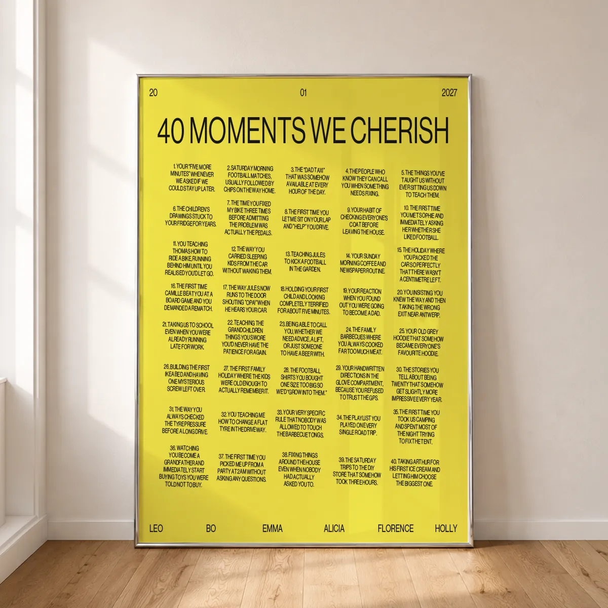 40 moments Tilted poster in acid yellow, framed against a wall