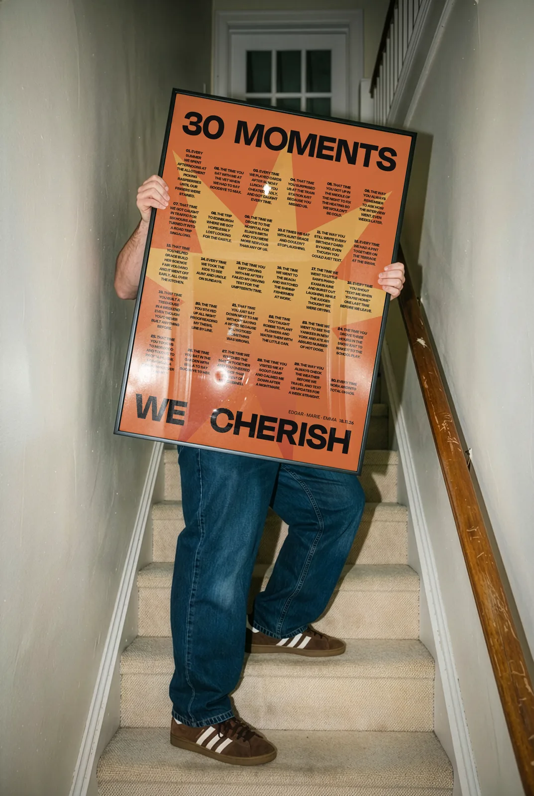 30 moments Fame poster in orange, framed against a wall
