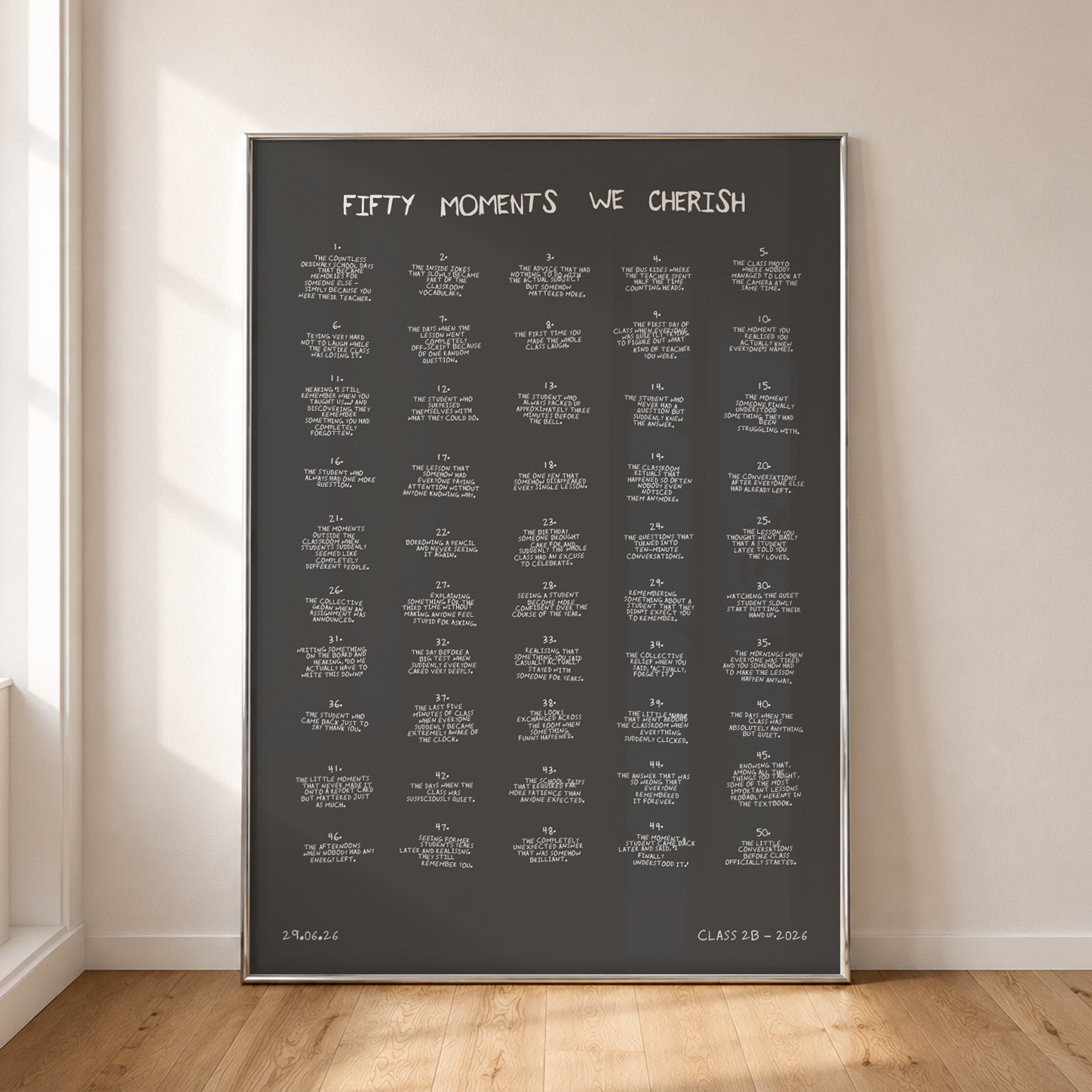 Fifty handwritten moments on a black poster, framed against a wall